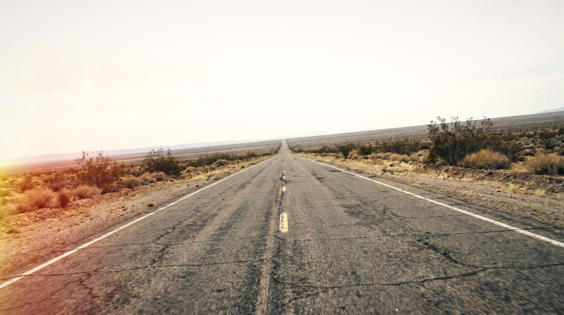 An open road running into sunrise